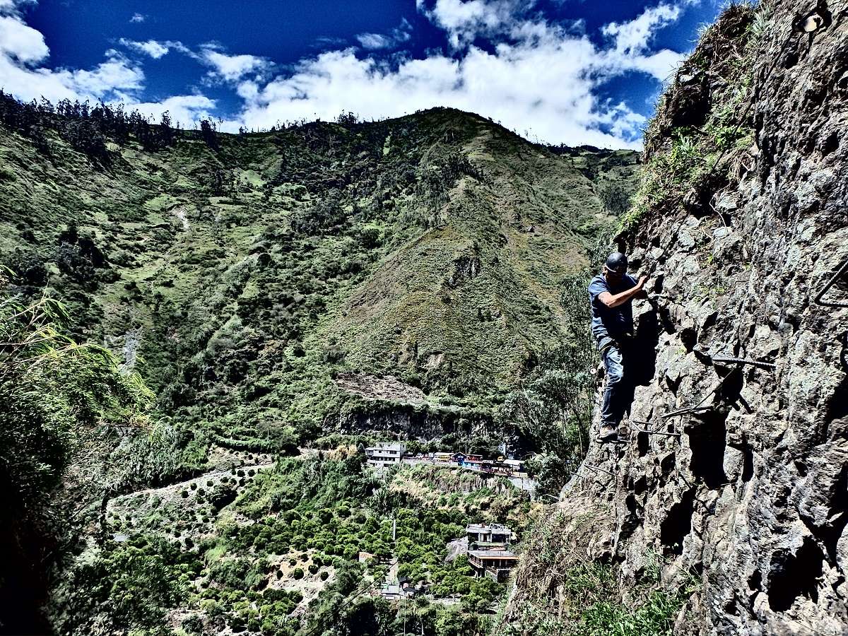 Rhys suspended along the side of the mountain shimmying his way back in